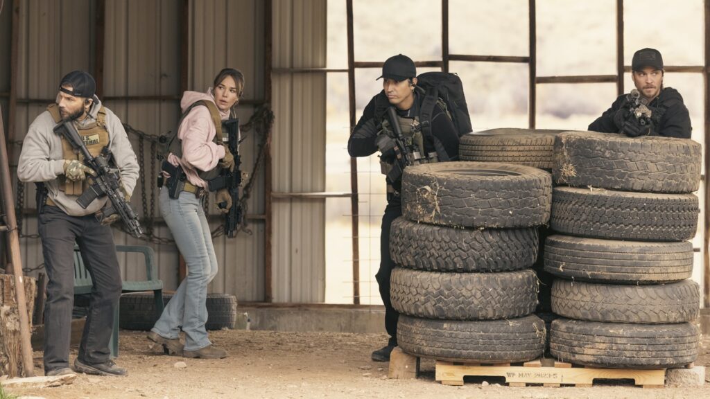 Pictured (L-R): Logan Marshall-Green as Pete Calvin, Arielle Kebbel as Belle, Tatanka Means as Miles, and Luke Grimes as Kayce Dutton, in Marshals. airing on CBS and streaming on Paramount+.