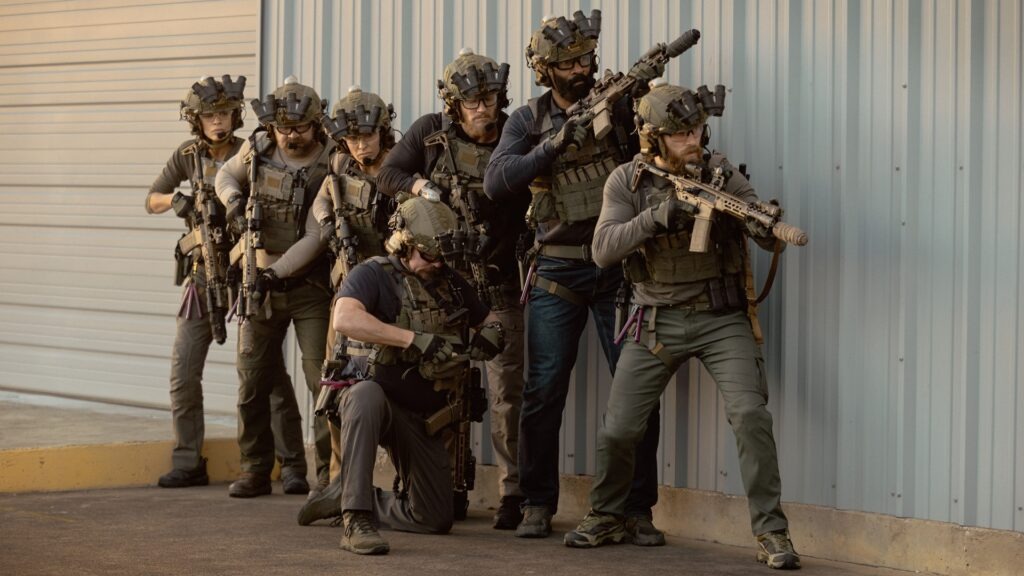 From left: Laysla De Oliveira as Cruz, Austin Hébert as Randy, Jill Wagner as Bobby, James Jordan as Two Cups, Jonah Wharton as Tex, LaMonica Garrett as Tucker, Thad Luckinbill as Kyle in Lioness Season 3.